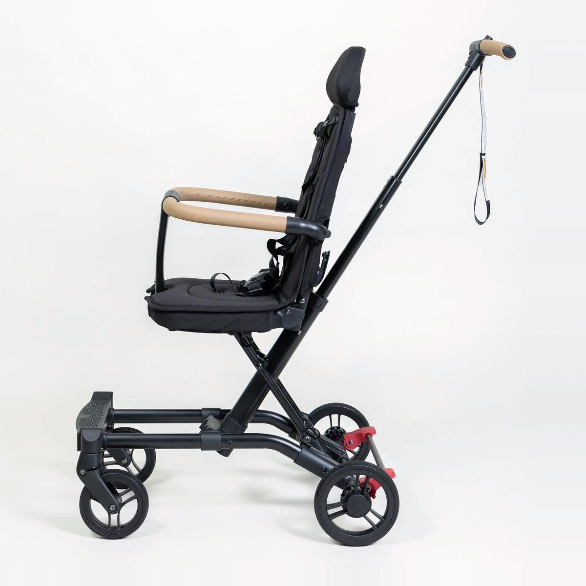 Milo Co-Rider Stroller in black, side view of the seat and wheels