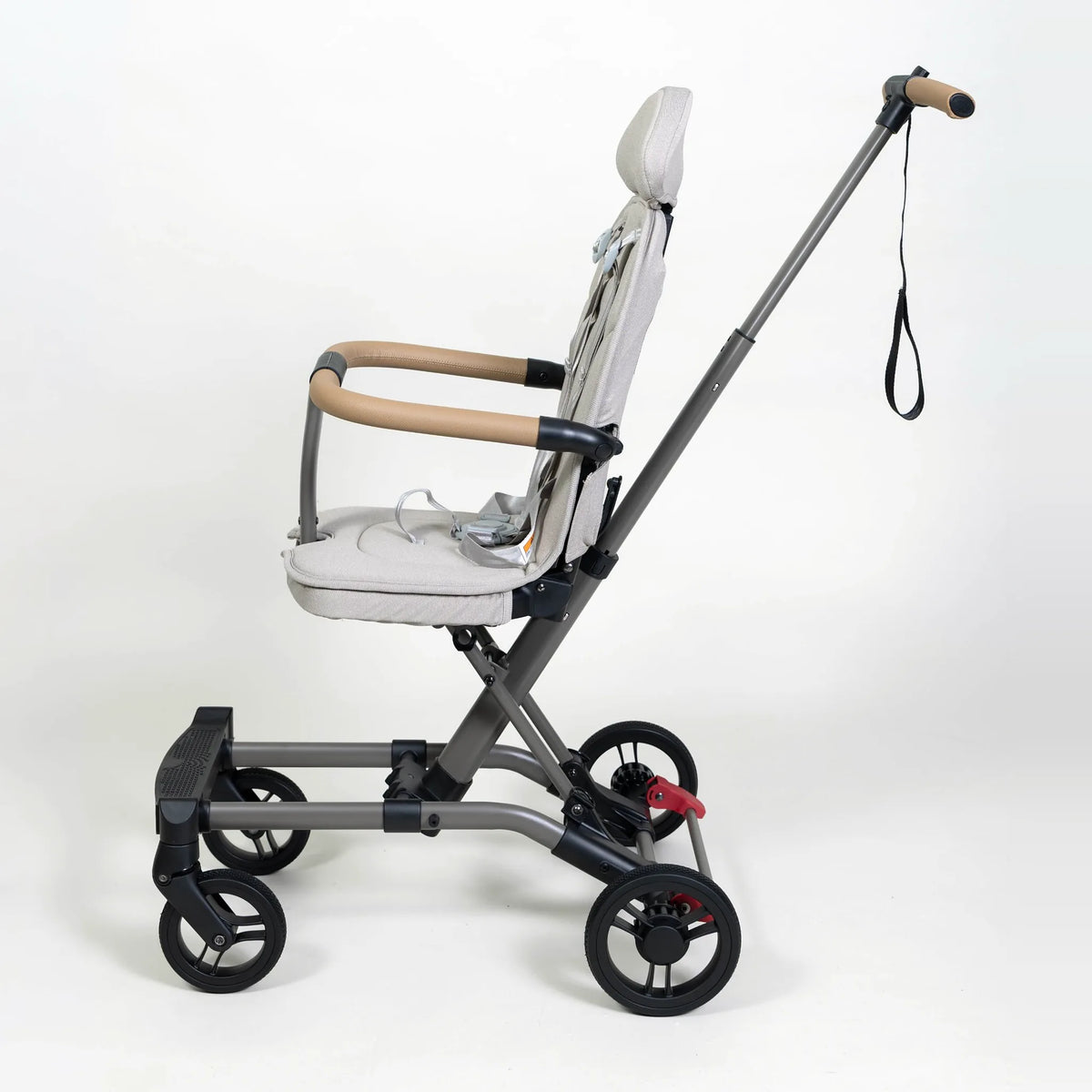 Milo Co-Rider Stroller in cream, side view of the seat and wheels
