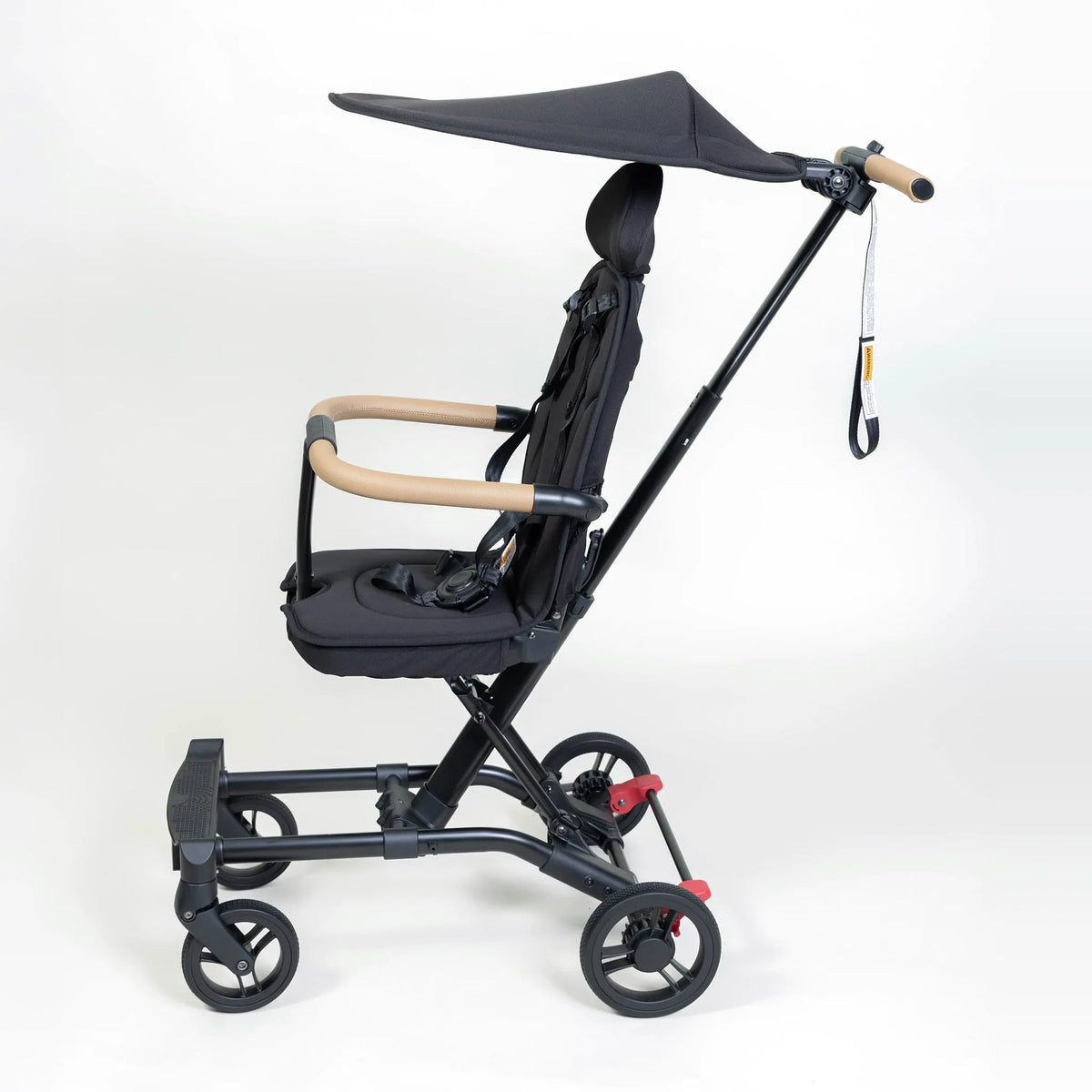 Black Milo Co-Rider Stroller shown with canopy (sold separately) for full shade