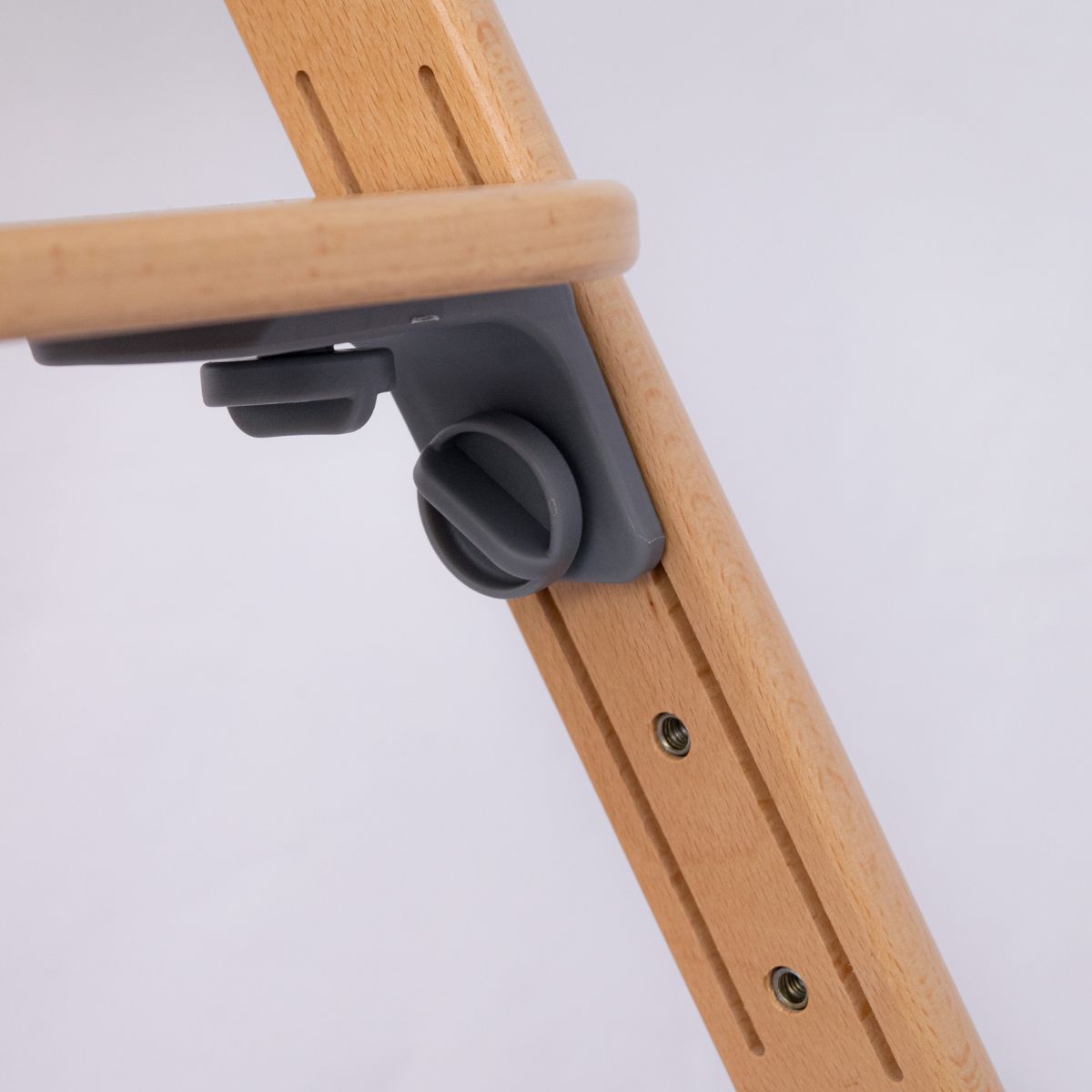 Close-up of the adjustable wooden footrest attachment on the Moose Harper highchair