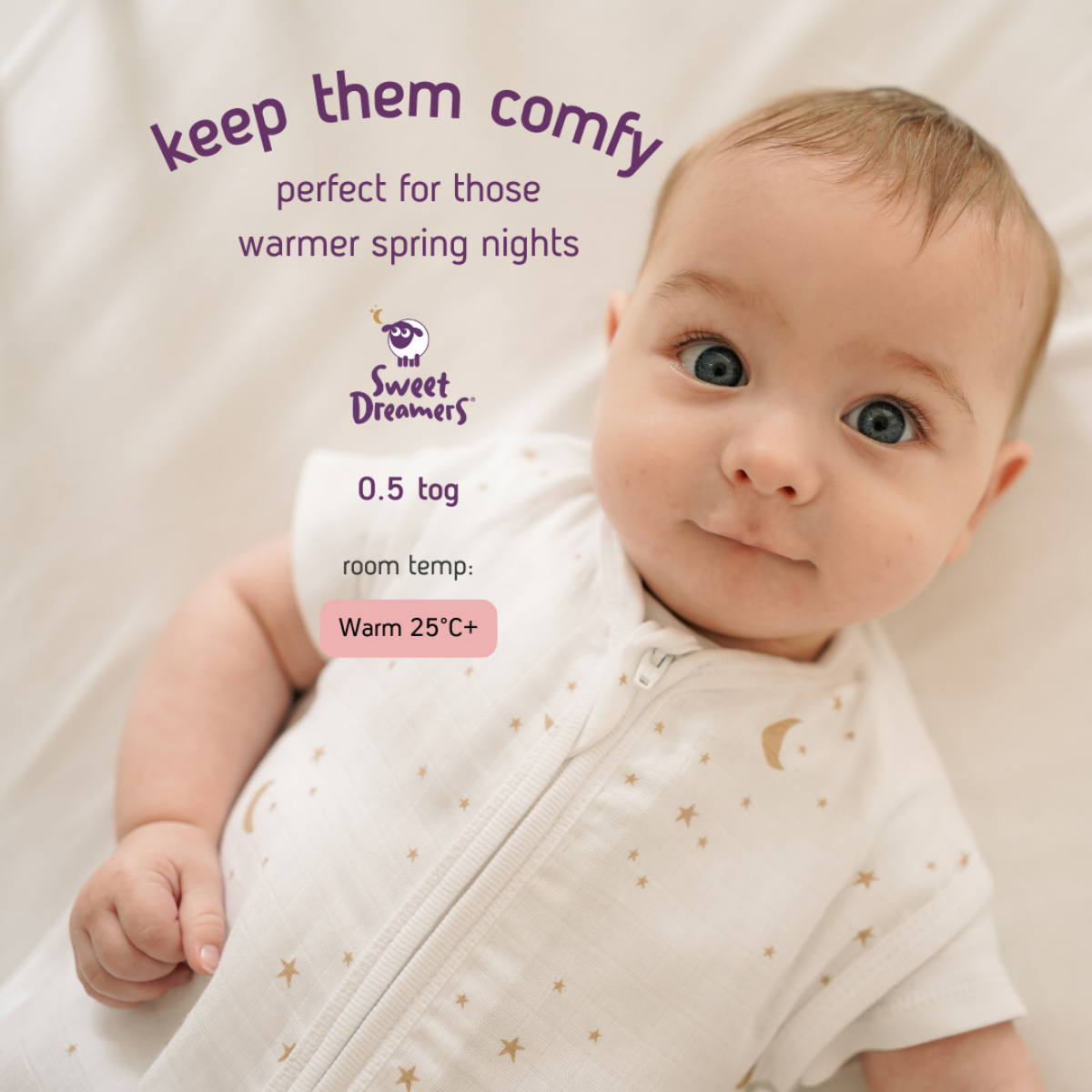 A baby wearing a white Sweet Dreamers Sleep & Swaddle Transition Bag with small gold star and moon prints, lying on a white bedding surface. Purple marketing text and a product badge for 'The Sweet Dreamers' are overlaid on the image.